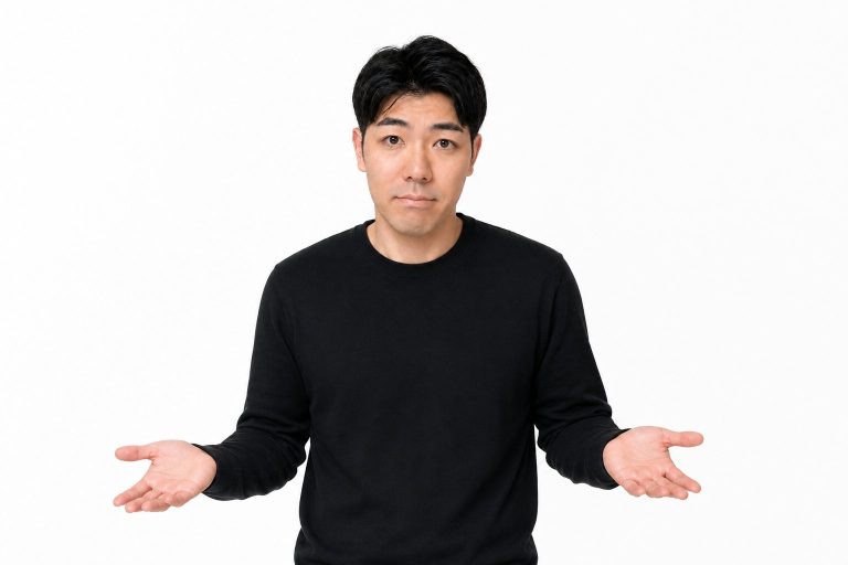 困って苦笑いする男性(白背景)