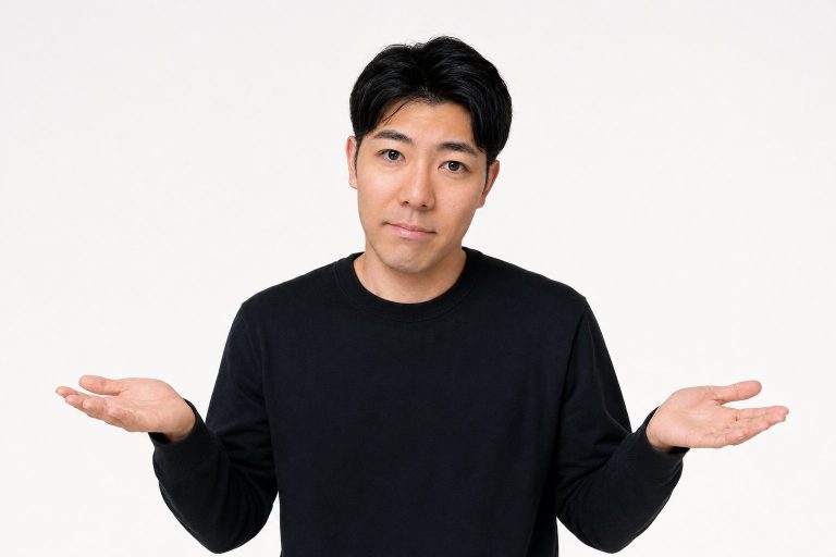 お手上げのポーズをする男性(白背景)