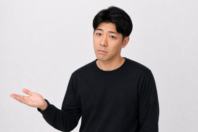 半信半疑で手を開く男性(白背景)
