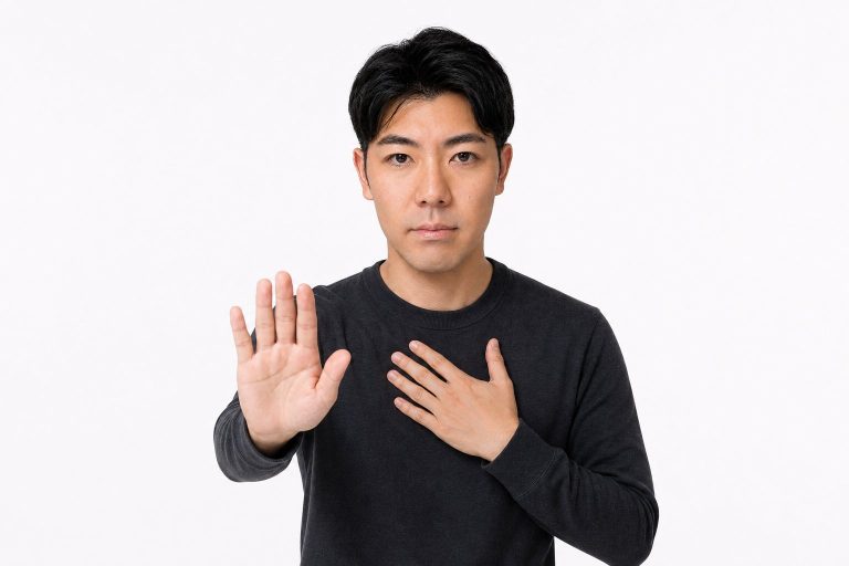 落ち着いてと手で制する男性(白背景)
